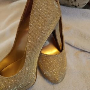 Gold high heel shoes